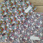 Tovaglietta con coniglietti e fiori rosa base blu trapuntata