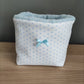 Cesta porta trucchi e prodotti con fiocchetto